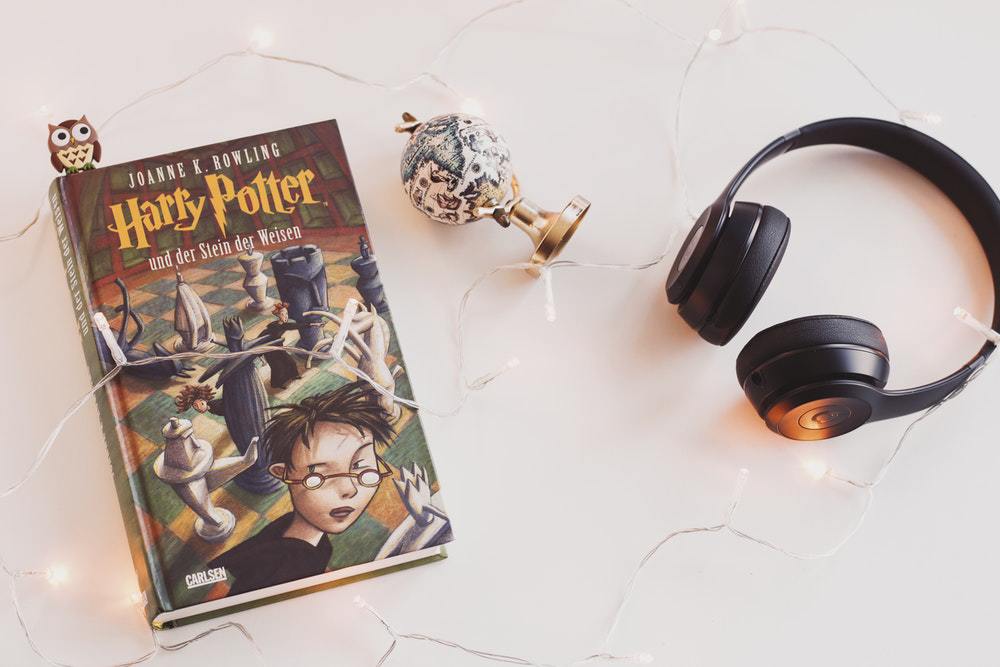 A photo of the Harry Potter book with some essentials