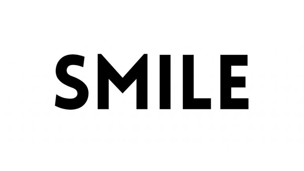 PowerPoint slide with the word "Smile" in it