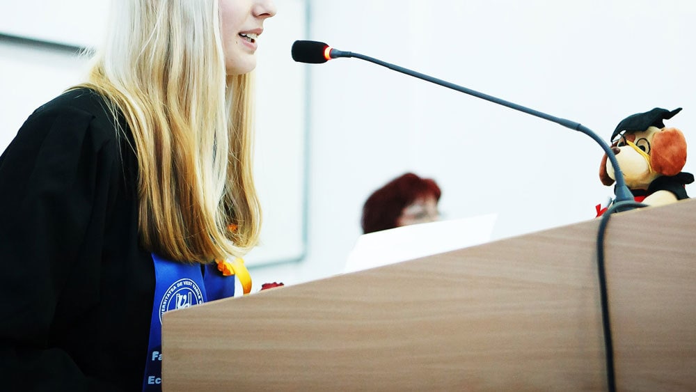 woman giving ceremonial speech in a graduation - a ceremonial speech - one of the types of public speaking