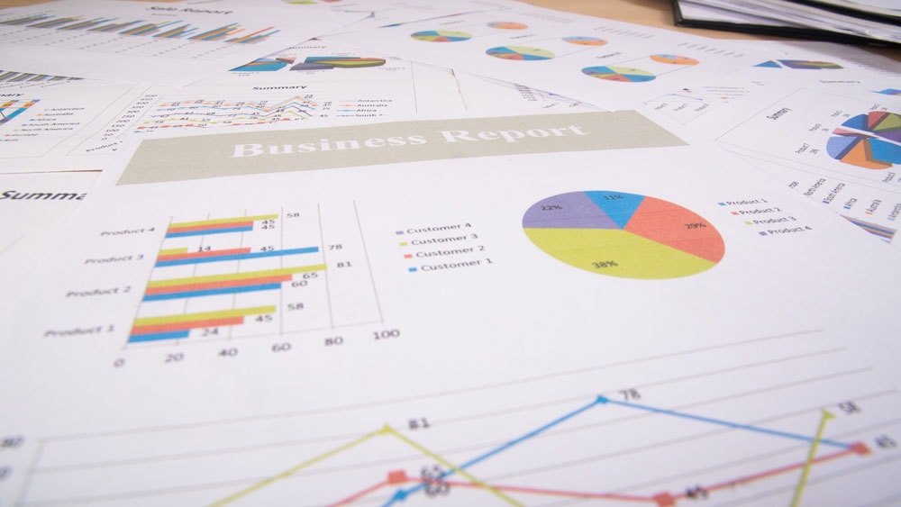 pages from a business report laid out on a table