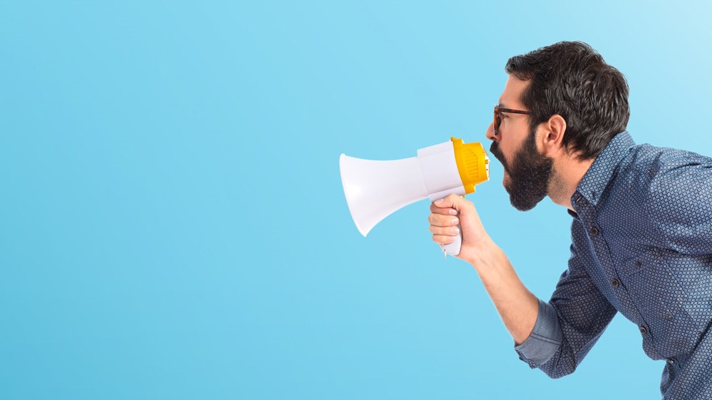 man screaming into a megaphone - design background